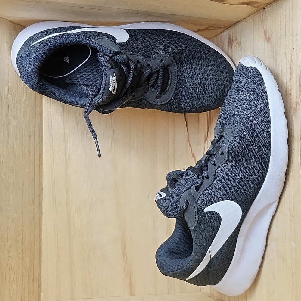 tan black and white nike